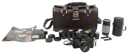 An Olympus OM-2N camera, together with a Hanimex Automatic Zoom C macro 5=80-200mm lens, flash,...