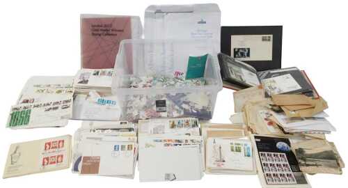 First day covers, together with loose stamps, postcards, etc. (1 box)