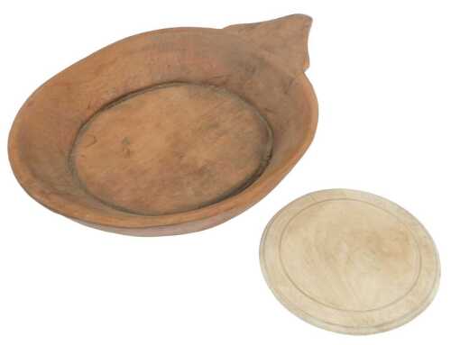 A wooden dough-kneading bowl, of circular form with a triangular-shaped protruding handle, 69cm...