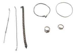 A group of silver and other costume jewellery, comprising two splayed twist bangles, a bead link...