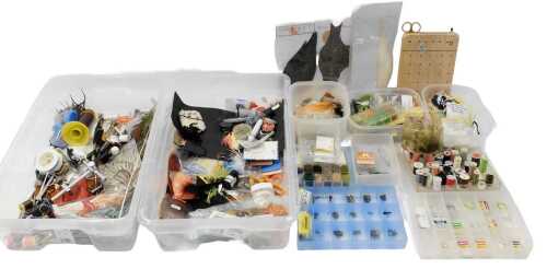 Fly-tying equipment, including a fly-tying vice, various feathers, various hook patterns, Orvis...