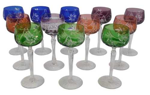 A harlequin set of twelve Bohemian flash glass hock glasses, comprising three examples in blue,...