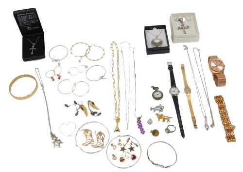 A group of assorted costume jewellery, to include flower pendant and chain, white metal tulip...