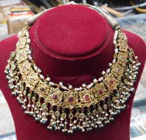 An antique enamel and gem set bridal necklace, the front set with an arrangement of green, red... - 9