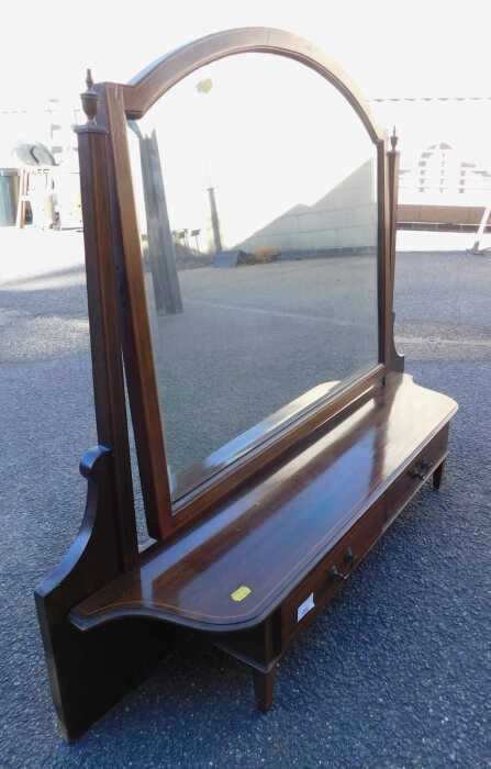 A late 19thC mahogany and inlaid swing frame mirror, the mirror with a rounded top flanked by...
