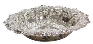A Victorian silver sweetmeat dish, with a crimped rim, embossed with foliate and C scrolls,...