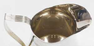 An Elizabeth II silver cream jug, with a reeded handle, Birmingham 1972, 3.83oz. - 3
