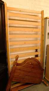 A pine single bed frame, comprising a headboard, footboard and slatted base.