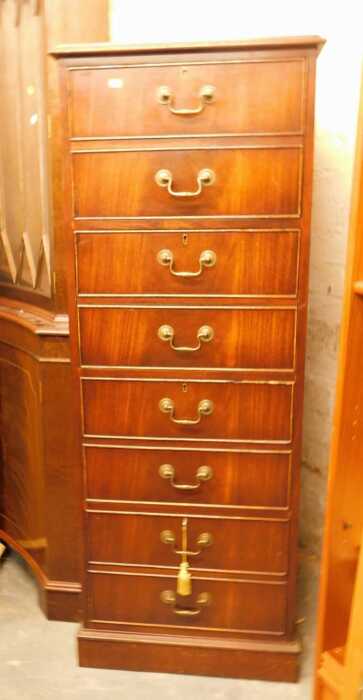 A 20thC mahogany filing cabinet, the top inset with a green tooled leather panel, above four...