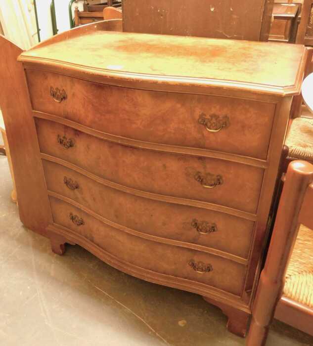 A 20thC burr walnut serpentine chest, of four long drawers, raised on bracket, 85cm high, 80cm...