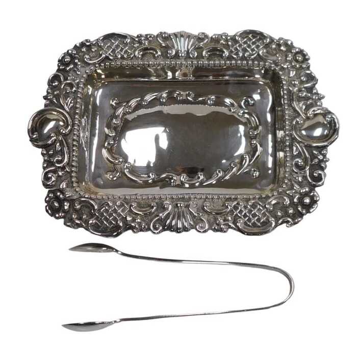 A Victorian silver dressing table tray, of twin handled rectangular form, with an embossed...