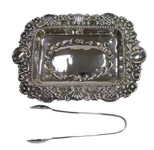 A Victorian silver dressing table tray, of twin handled rectangular form, with an embossed...