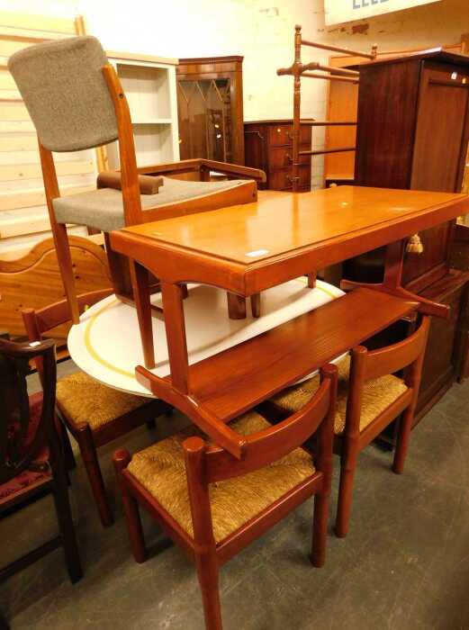 A group of furniture, to include a melamine topped table, various chairs with rush seats, two...
