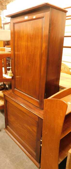 A 19thC mahogany cabinet, the top with a moulded edge above a panelled door enclosing various...