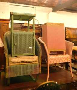A group of wicker Lloyd Loom style furniture, comprising a green painted rocking chair and side...