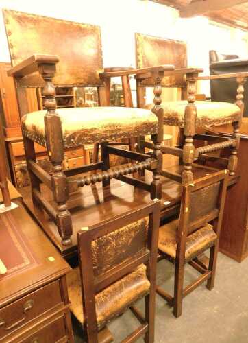 An oak drawer leaf table, raised on a part carved trestle type base, 76cm high, the top 126cm x...