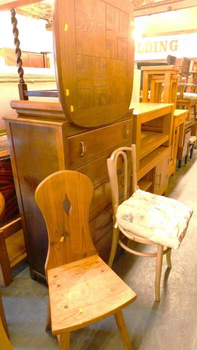 A group of furniture, to include an oak five drawer chest, an oak occasional table raised on...
