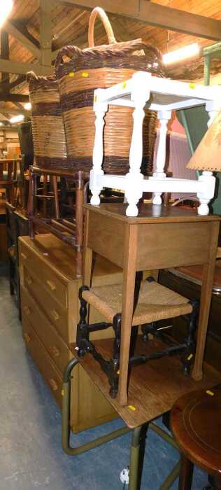 A group of furniture, to include an oak chest of four graduated drawers, two wicker log baskets,...