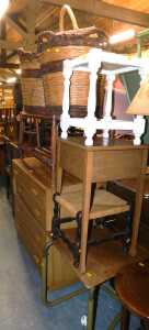 A group of furniture, to include an oak chest of four graduated drawers, two wicker log baskets,...