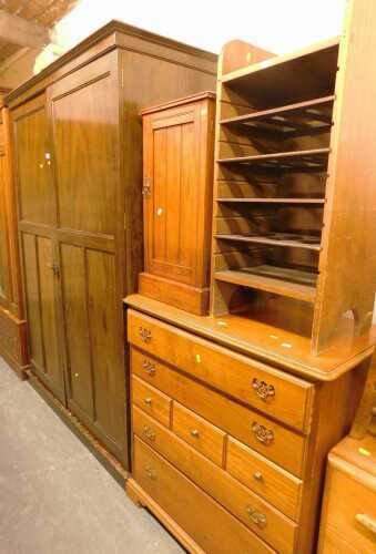 An Aurlyn oak wardrobe, the two panelled doors enclosing a hanging rail, various recesses and...