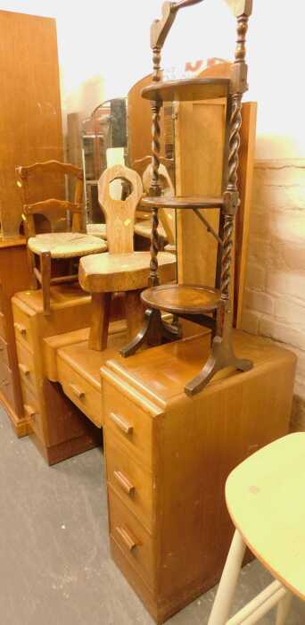 A group of furniture, comprising a walnut mirror back dressing table, two chairs and an oak...
