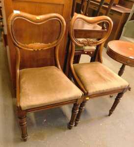 A pair of Victorian mahogany dining chairs, each with a kidney shaped part carved back, drop in...
