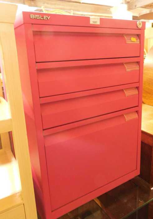 A Bisley pink metal filing cabinet, with four graduated drawers, 71cm high, 46cm wide, 48cm deep.