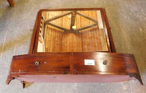 A 19thC mahogany swing framed toilet mirror, the bow front with two drawers raised on bracket...