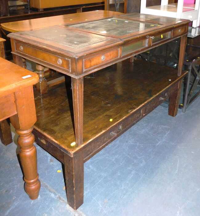 A 20thC mahogany coffee table, with a central glass lift up section flanked by two green tooled...