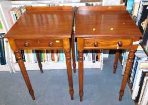 A pair of mahogany and oak side tables, in Victorian style, each with a raised back, above a...