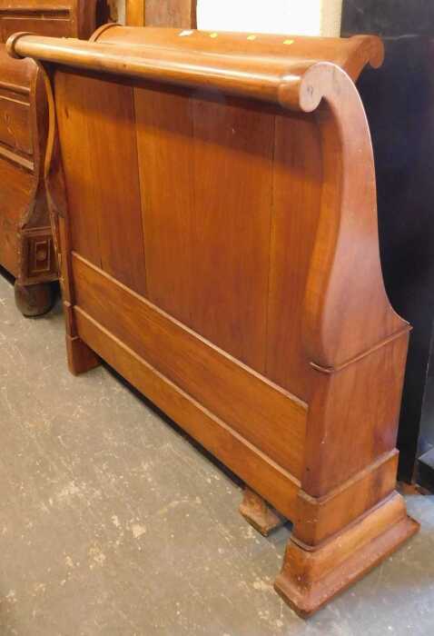 A hardwood single sleigh bed, with headboard, footboard and side rails.