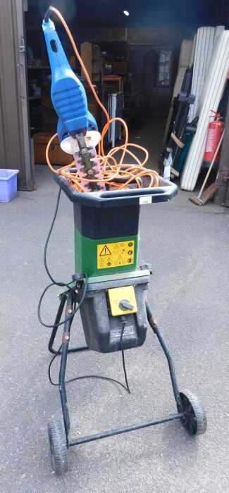 A Parkside electric garden shredder, PKGH 2400FF, together with a Hyundai electric hedge trimmer.