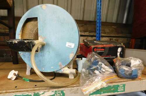 A bench top grinding machine, together with accessories.