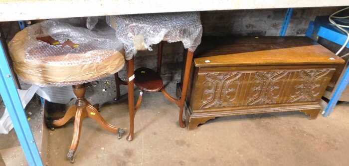 An oak blanket chest, with a carved front, together with a two tier window table and an...