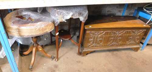 An oak blanket chest, with a carved front, together with a two tier window table and an...