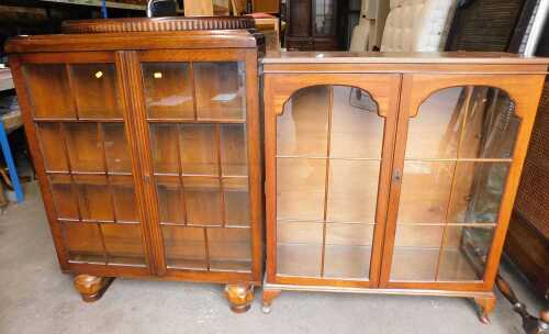 An oak display cabinet, with glass fronted panelled doors, 123cm high, 93cm wide, and another.