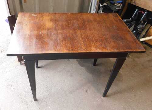 An oak side table, raised on square tapering ebonised legs.