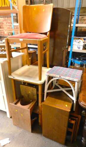 A group of furniture, to include a nest of tables, dining chair, etc. 
The upholstery in this...