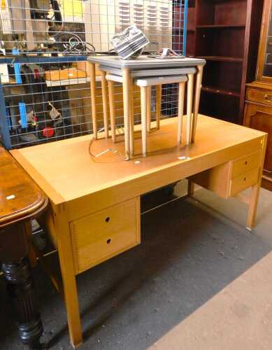 A contemporary oak desk or dressing table, 70cm high, 131cm wide, 64cm deep, together with a...