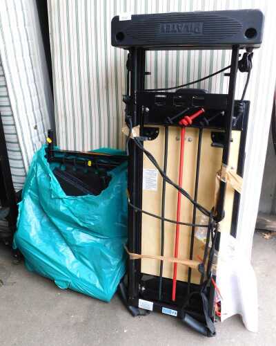 An Aero pilates machine, with additional accessories.