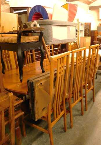 V - A pine dining table together with six chairs, an ebonised piano stool, baby basinette, etc. (a...