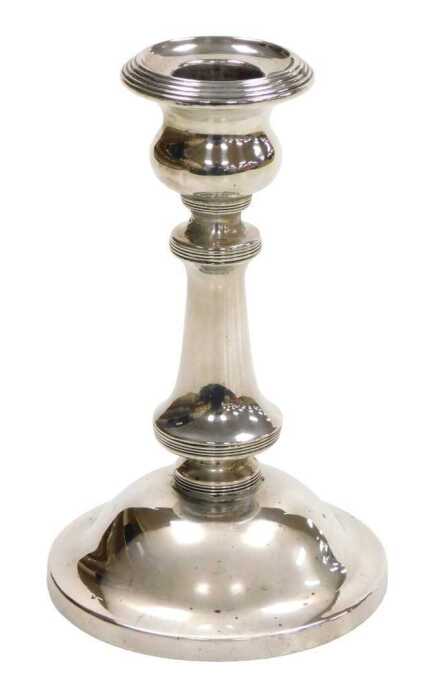 An Edward VII loaded silver candlestick, with reeded banding, Birmingham 1907, 11.29oz all in,...
