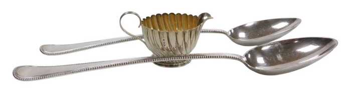 An Edward VII silver cream jug, of spiral fluted form, Birmingham 1902, 1.61oz, together with a...