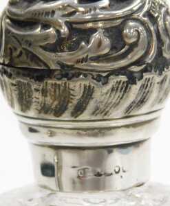 A Victorian cut glass scent bottle, with a silver mount and screw lid, embossed with flowers and... - 3