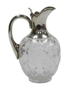 A Victorian cut glass and silver mounted claret jug, with a silver handle and hinged lid,...