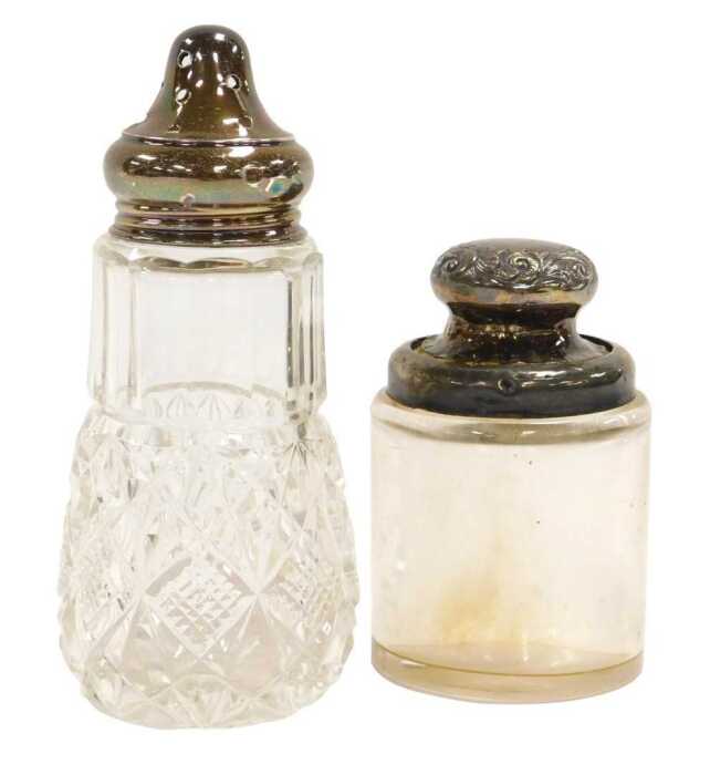 A George V cut glass and silver lidded sugar sifter, London 1927, and a Victorian cut glass and...