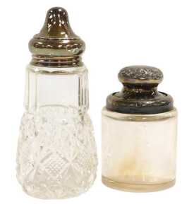 A George V cut glass and silver lidded sugar sifter, London 1927, and a Victorian cut glass and...