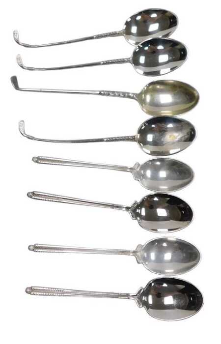 A set of four QEII silver golfing commemorative coffee spoons, Sheffield 1975, and four further...