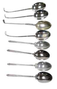 A set of four QEII silver golfing commemorative coffee spoons, Sheffield 1975, and four further...