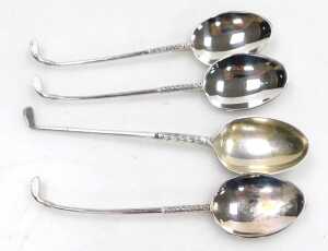 A set of four QEII silver golfing commemorative coffee spoons, Sheffield 1975, and four further... - 2